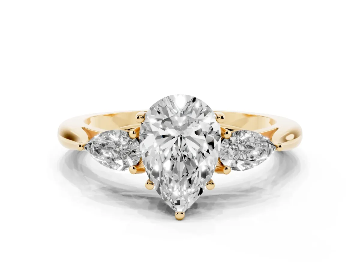 Pear Cut Diamond Three-Stone Ring with Pear Side Stones and Prong Setting Yellow gold