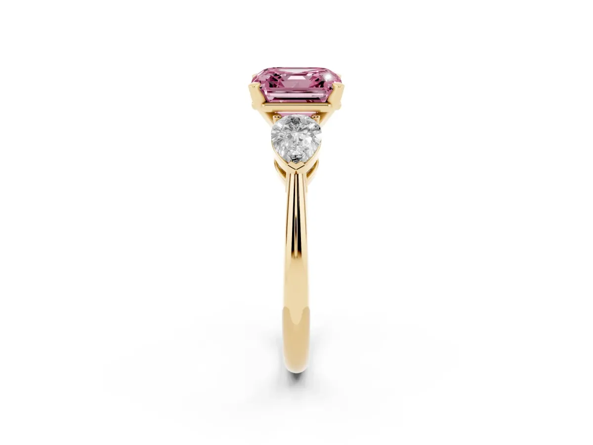 Fancy Pink Three-Stone Asscher Cut Diamond Ring with Pear Side Stones and Four-Prong Setting Yellow gold
