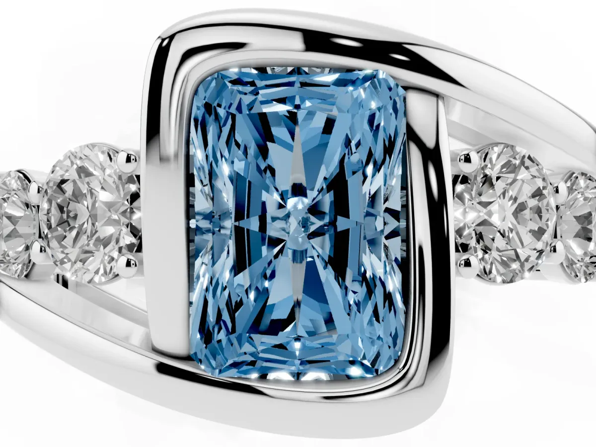 Fancy Blue Bezel Set Radiant Cut Diamond Bypass Ring with Round Accents Silver