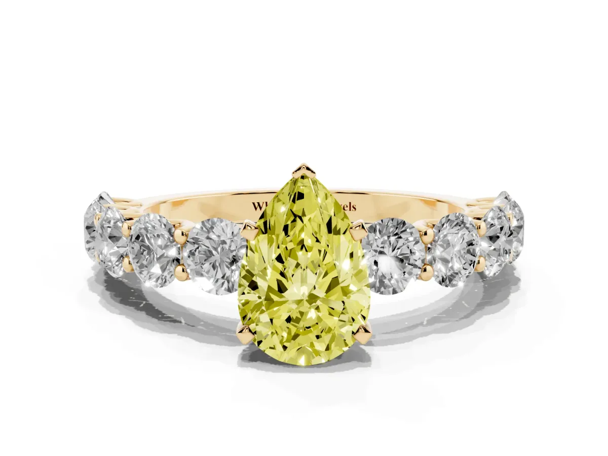 Fancy Yellow Pear Cut Diamond Prong Setting with Side Stones on a Pave Band Yellow gold