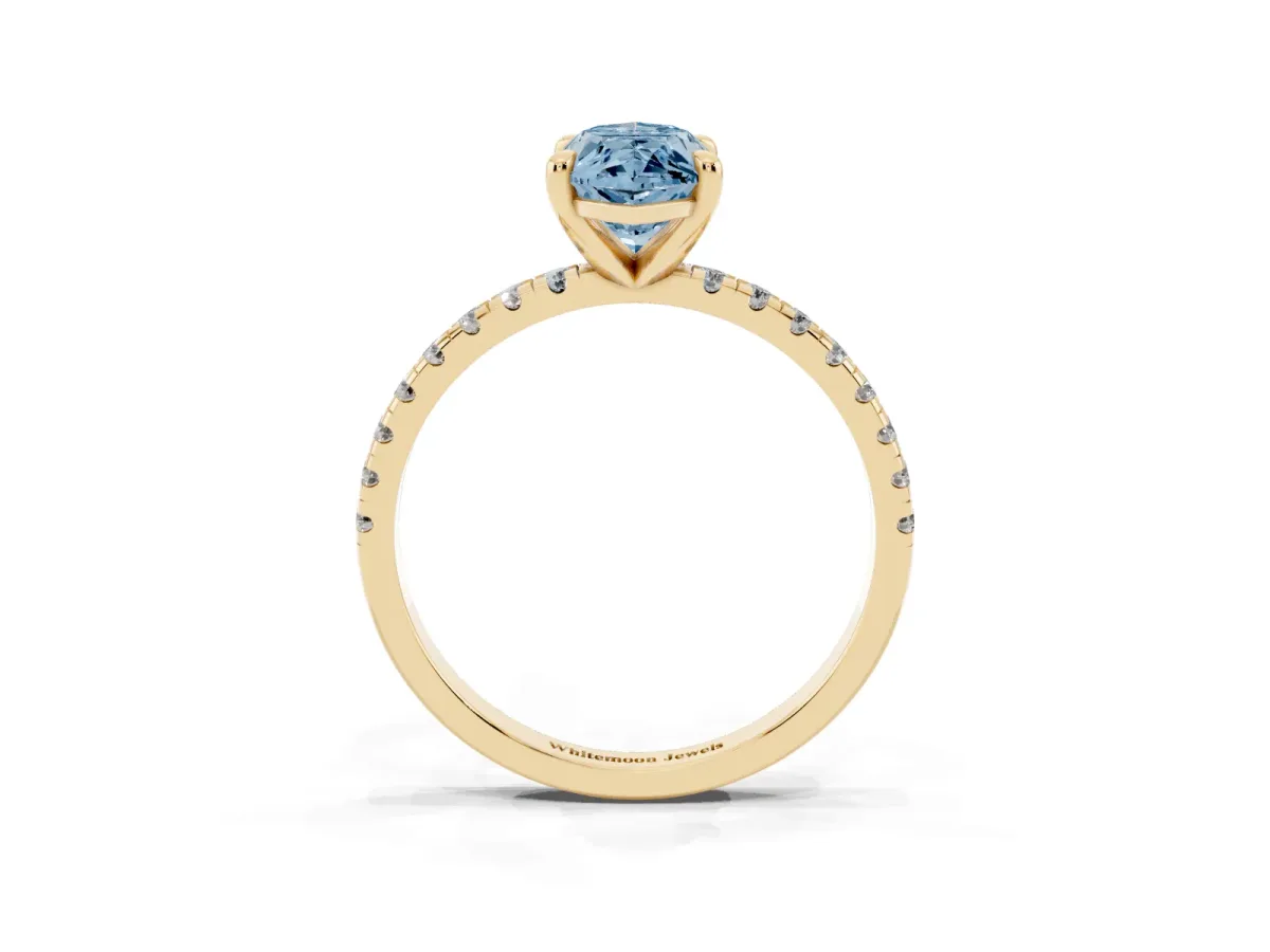 Fancy Blue Marquise Cut Diamond Brilliant Solitaire Ring with Pavé Band and Four-Prong Setting Yellow gold