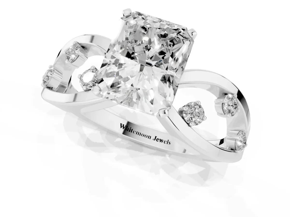Radiant Cut Cut Solitaire Diamond with Side Stones on Criss-Cross Band and Four-Prong Setting Platinum