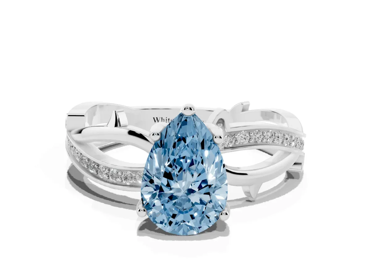 Fancy Blue Pear Cut Solitaire Twist Band with Pavé Accents and Four-Prong Setting Platinum