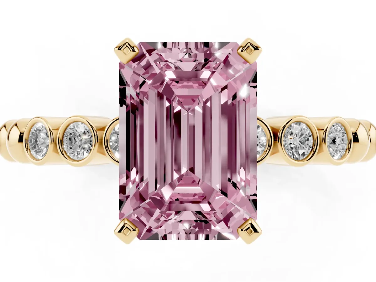 Fancy Pink Emerald Cut Solitaire Bezel Accent Diamond Engagement Ring with Beaded Band and Four-Prong Setting Yellow gold