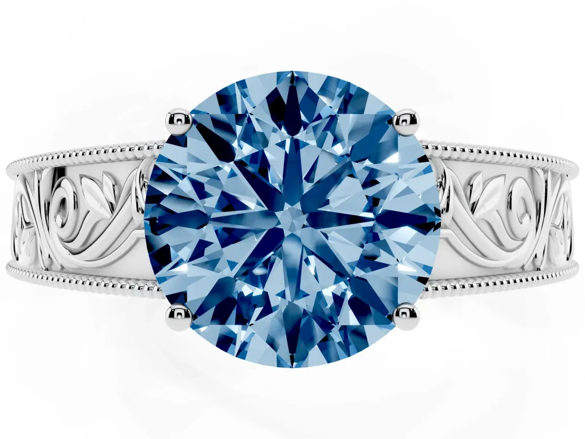 Fancy Blue Round Cut Diamond Solitaire Ring with Engraved Band and Four-Prong Setting White gold