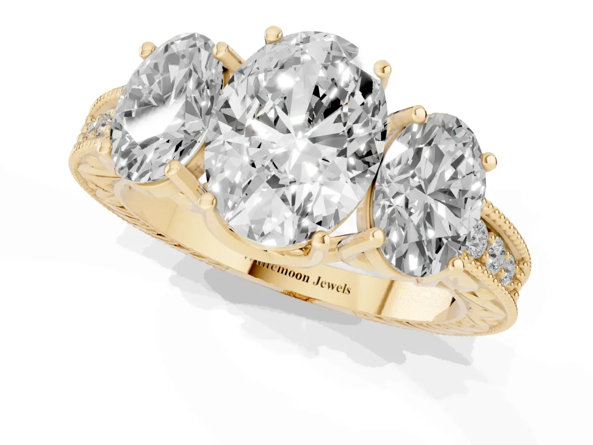 Three-Stone Oval Cut Cut Milgrain Pavé Engagement Ring Yellow gold