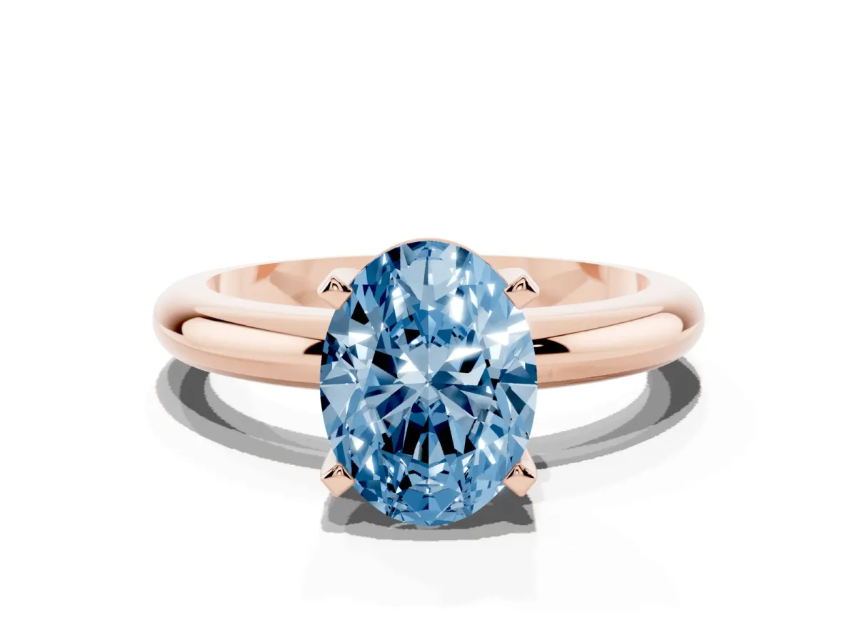 Fancy Blue Oval Cut Diamond Solitaire Engagement Ring with Round Band and Four-Prong Setting Rose gold