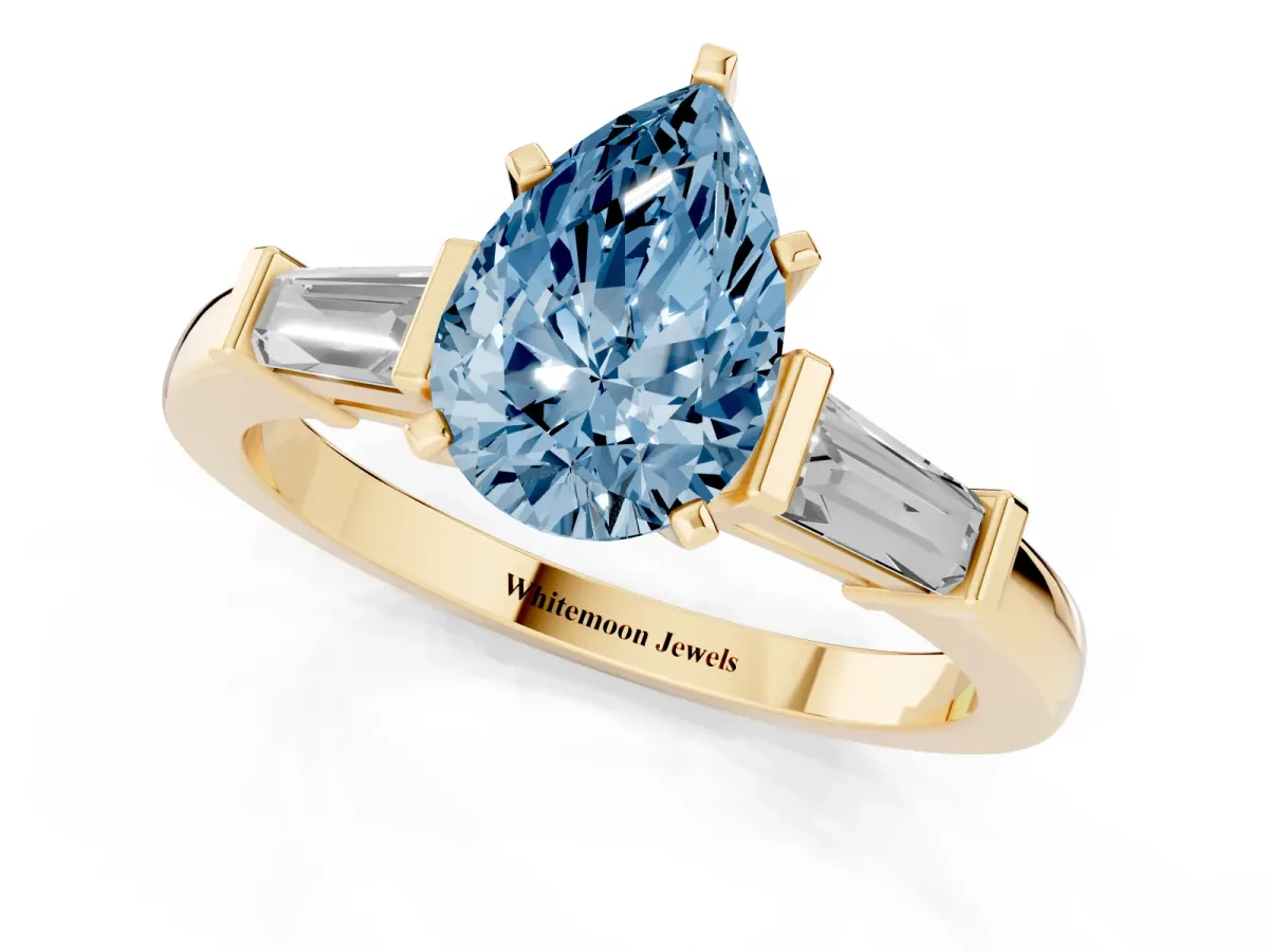 Fancy Blue Pear Cut Cut Diamond Solitaire Ring with Tapered Baguette Accents and Four-Prong Setting Yellow gold