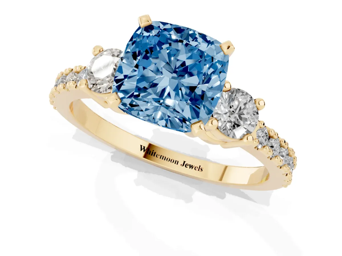 Fancy Blue Cushion Cut Three-Stone Diamond Pavé Band with Prong Setting Yellow gold