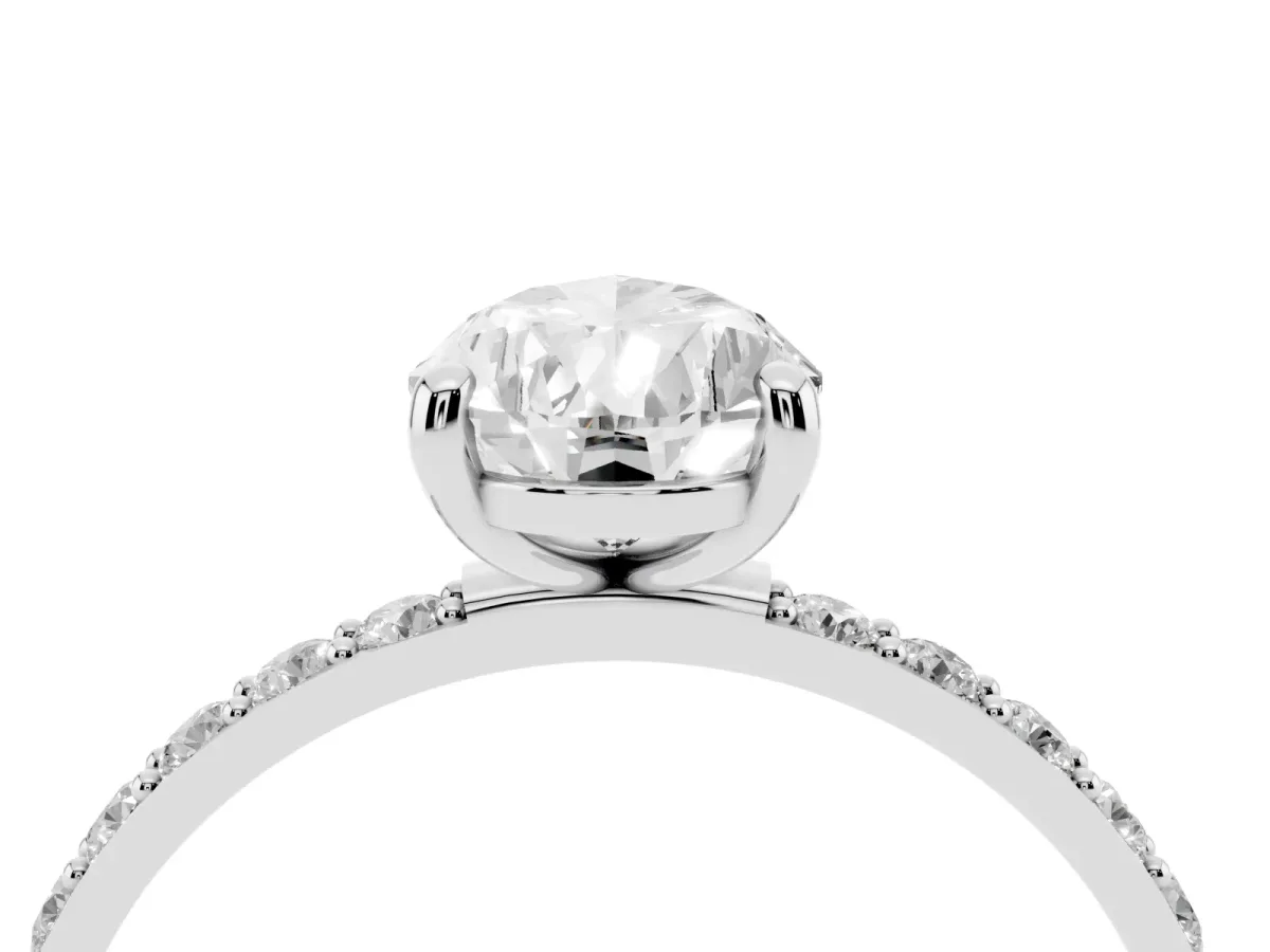 Pear Cut Diamond Solitaire Ring with Round Pavé Band and Prong Setting Silver
