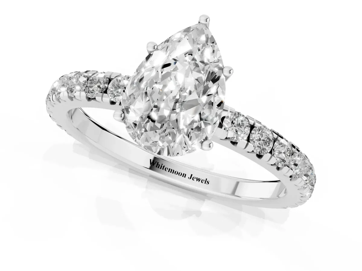 Pear Cut Diamond Pavé Solitaire Engagement Ring with Four-Prong Setting Platinum