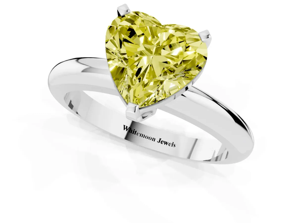 Fancy Yellow Heart Cut Diamond Solitaire Engagement Ring with Round Band and Four-Prong Setting Platinum