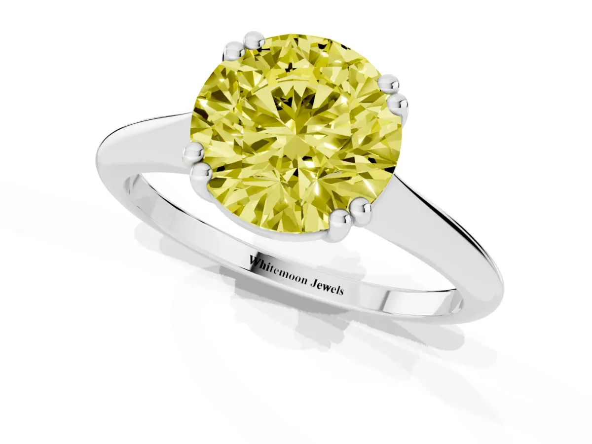 Fancy Yellow Round Cut Solitaire Diamond Ring with Six-Prong Setting and Classic Band Silver