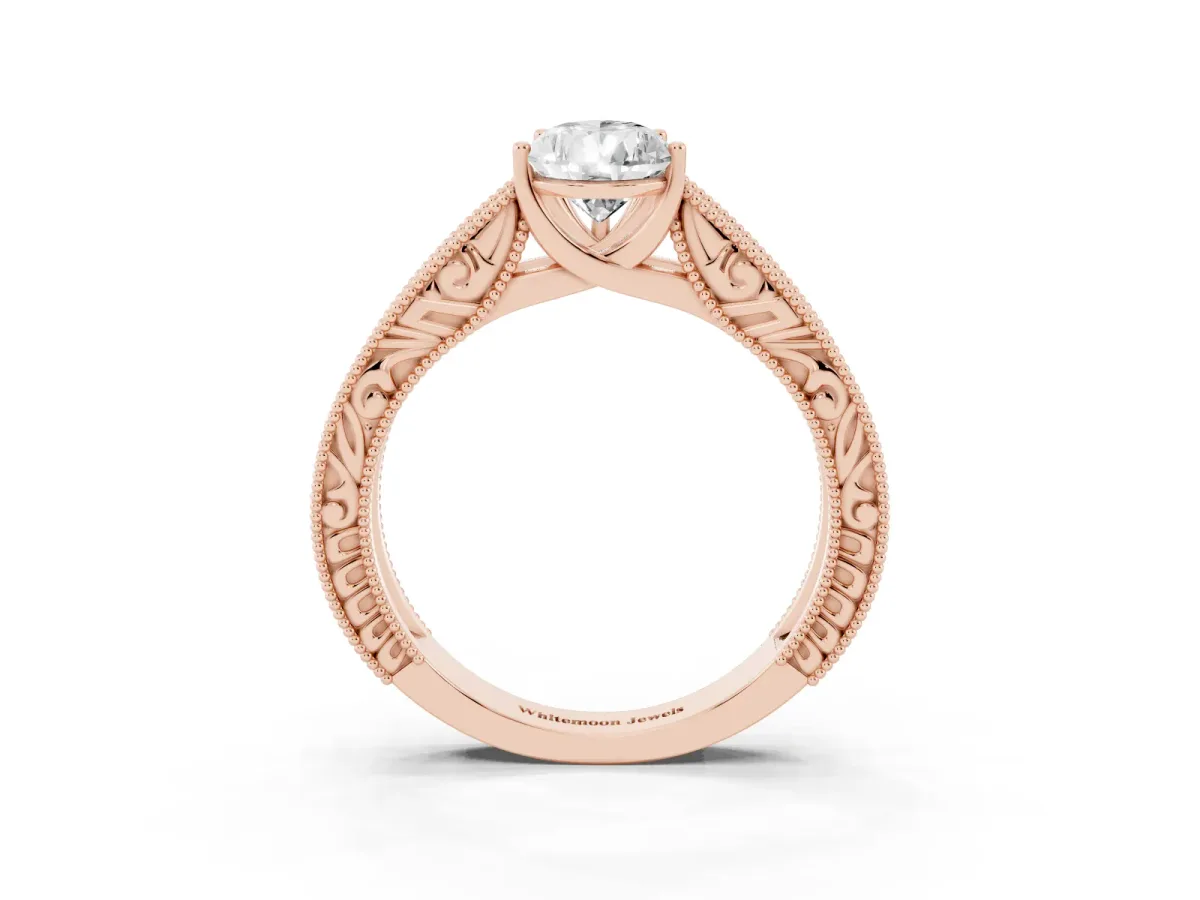 Pear Cut Diamond Solitaire Ring with Engraved Band and Four-Prong Setting Rose gold