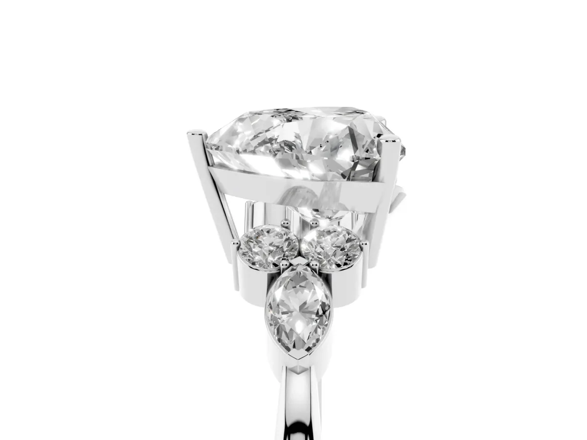 Heart Cut Brilliant Diamond Solitaire Ring with Pear Side Stones and Four-Prong Setting Platinum