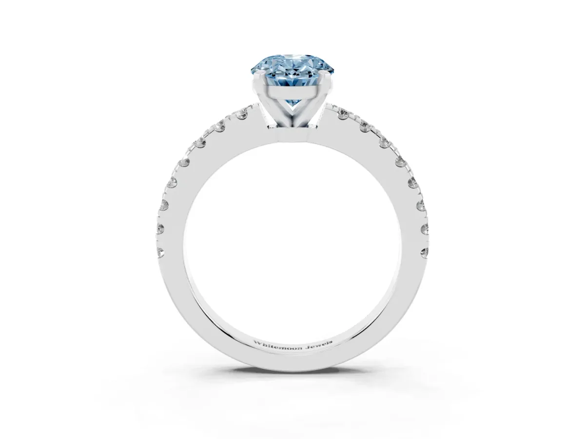 Fancy Blue Oval Cut Solitaire Diamond with Pavé Band and Four-Prong Setting Silver