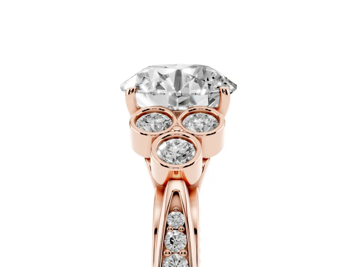 Round Cut Cut Diamond Engagement Ring with Bezel Set Round Side Stones and Prong Setting Rose gold