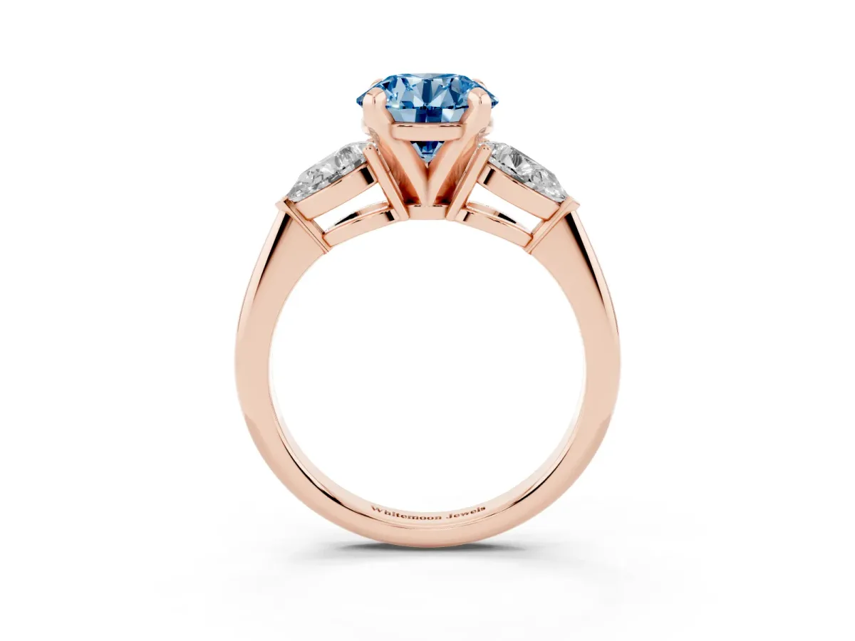 Fancy Blue Three-Stone Round Cut Diamond Ring with Pear Side Stones and Four-Prong Setting Rose gold