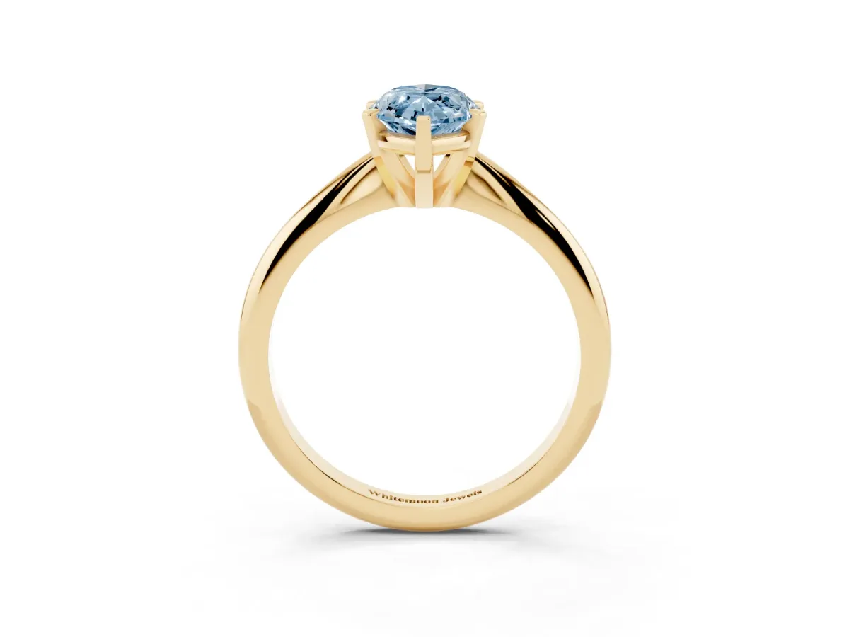 Fancy Blue Marquise Cut Cut Solitaire Ring with Four-Prong Setting on a Classic Band Yellow gold