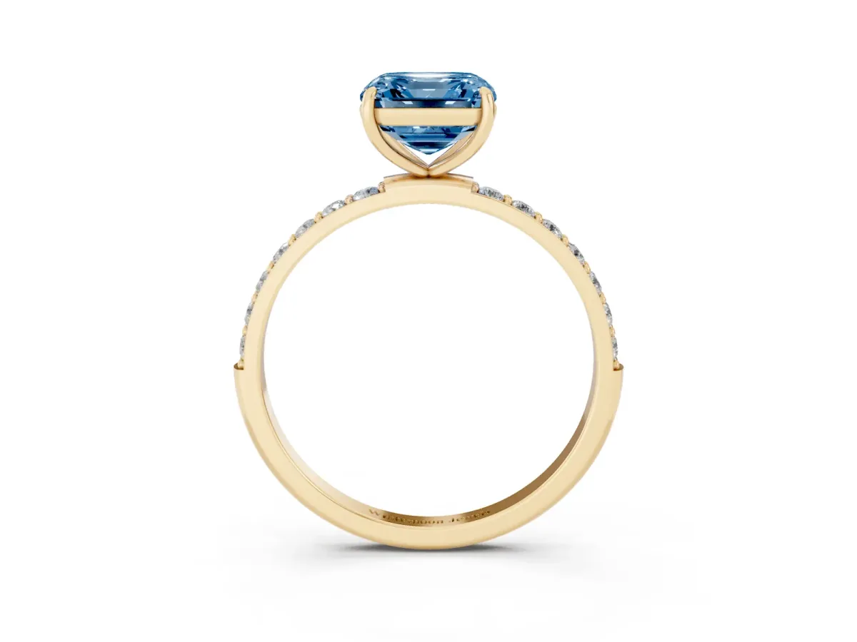 Fancy Blue Asscher Cut Diamond Solitaire Ring with Round Pavé Shoulders and Prong Setting Yellow gold