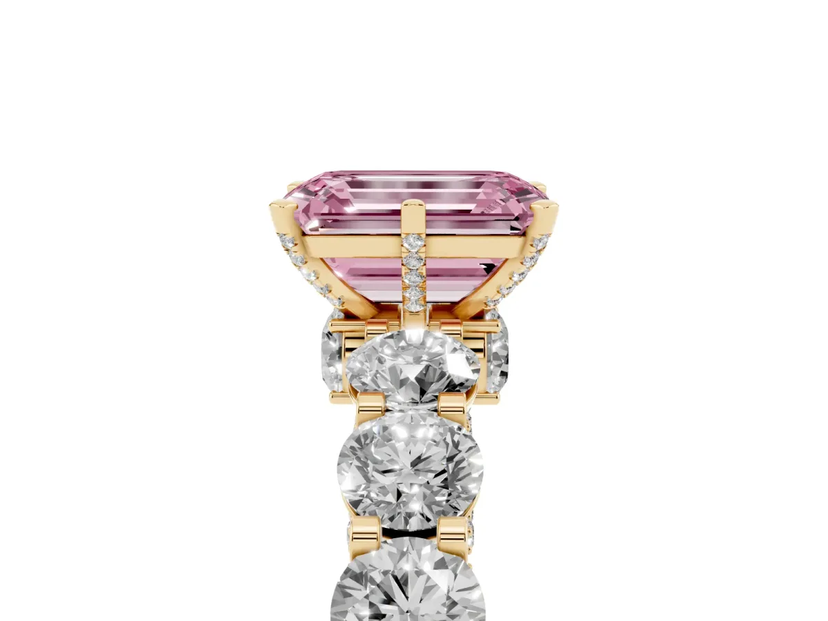 Fancy Pink Emerald Cut Diamond Side Stone Engagement Ring with Four-Prong Setting Yellow gold