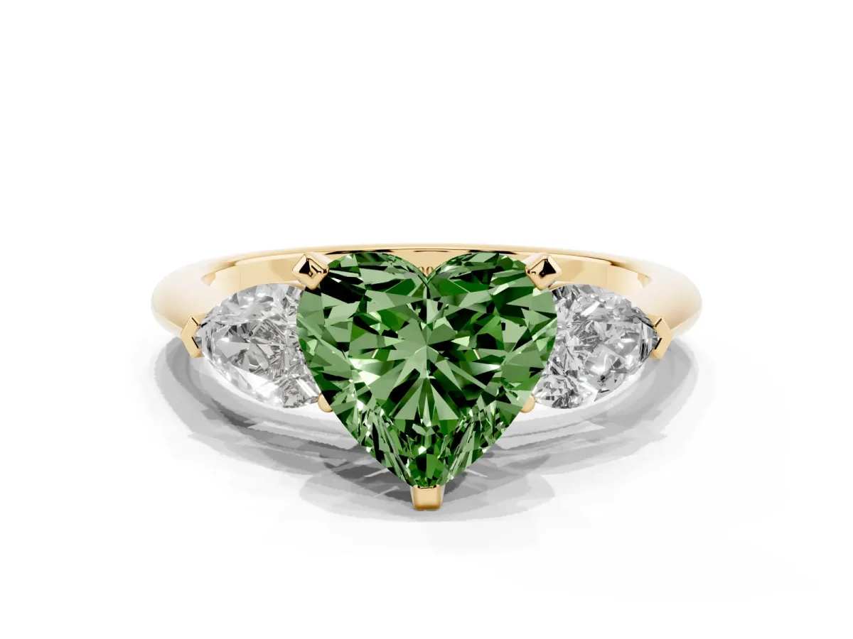 Fancy Green Three-Stone Heart Cut Diamond Ring with Pear Side Stones and Four-Prong Setting Yellow gold