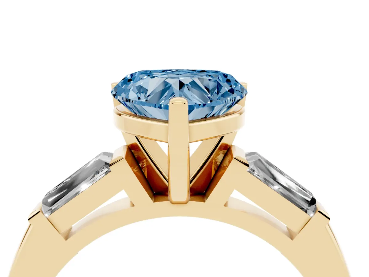 Fancy Blue Heart Cut Solitaire with Tapered Baguette Side Stones on a Classic Band with Four-Prong Setting Yellow gold