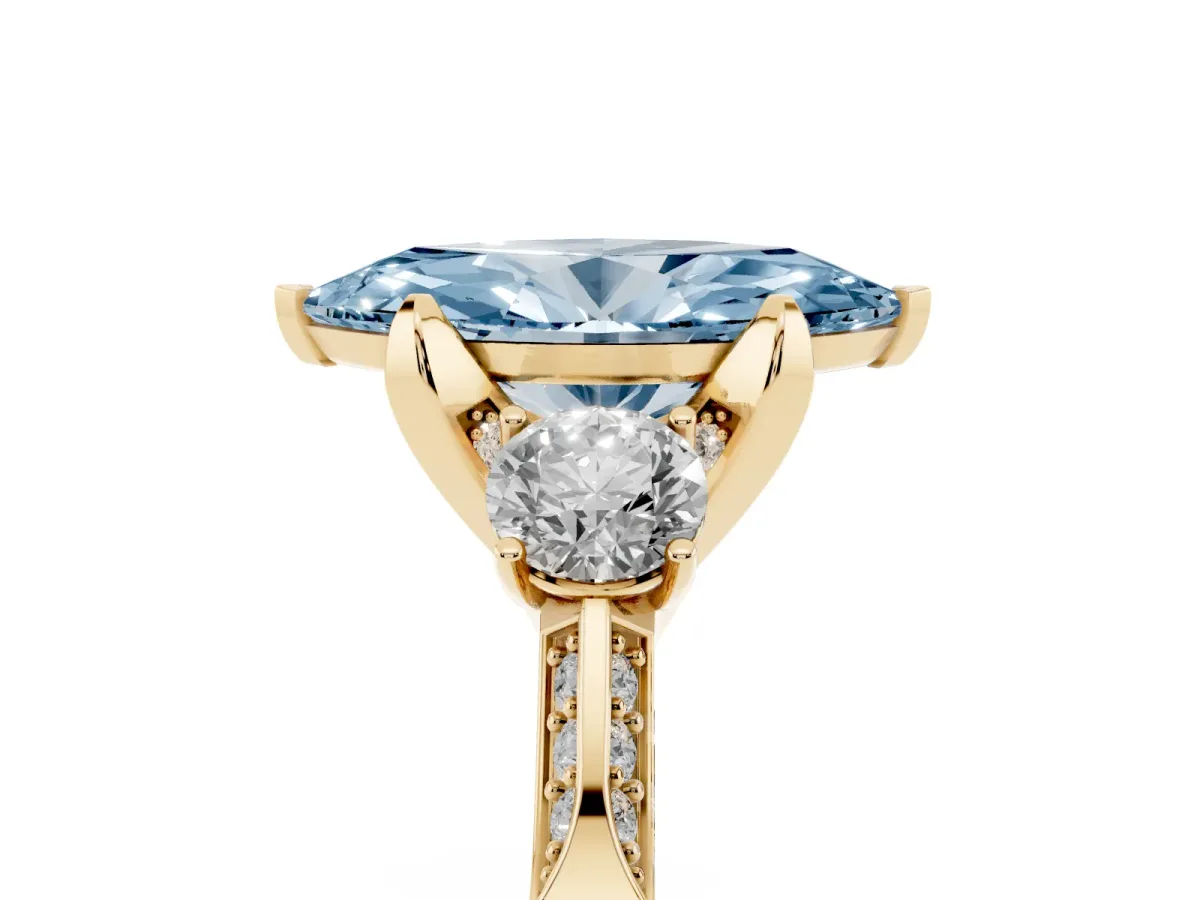 Fancy Blue Marquise Cut Brilliant Three-Stone Diamond Ring with Pavé Band and Four-Prong Setting Yellow gold