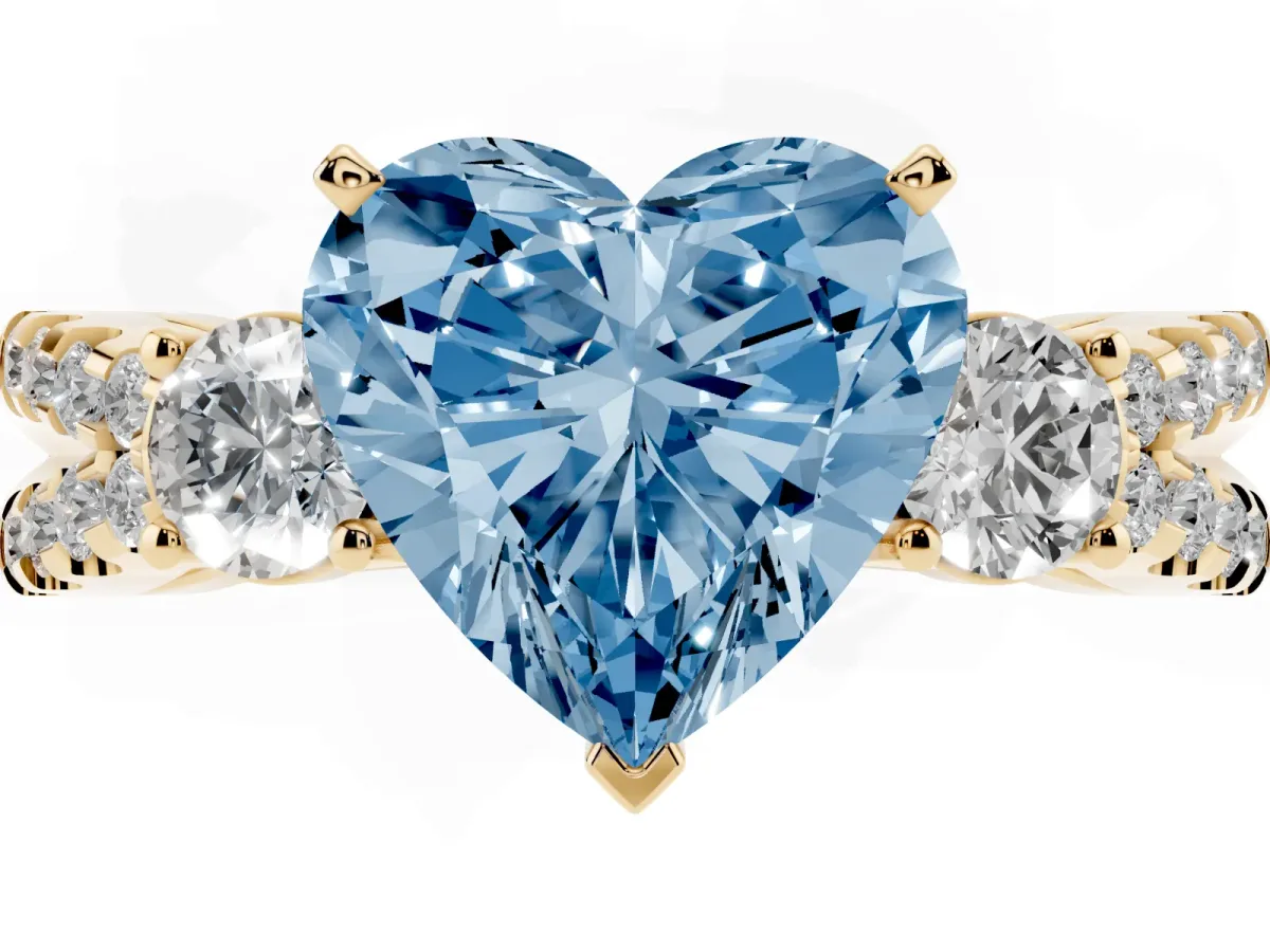 Fancy Blue Heart Cut Diamond Three-Stone Ring with Pavé Split Shank and Four-Prong Setting Yellow gold