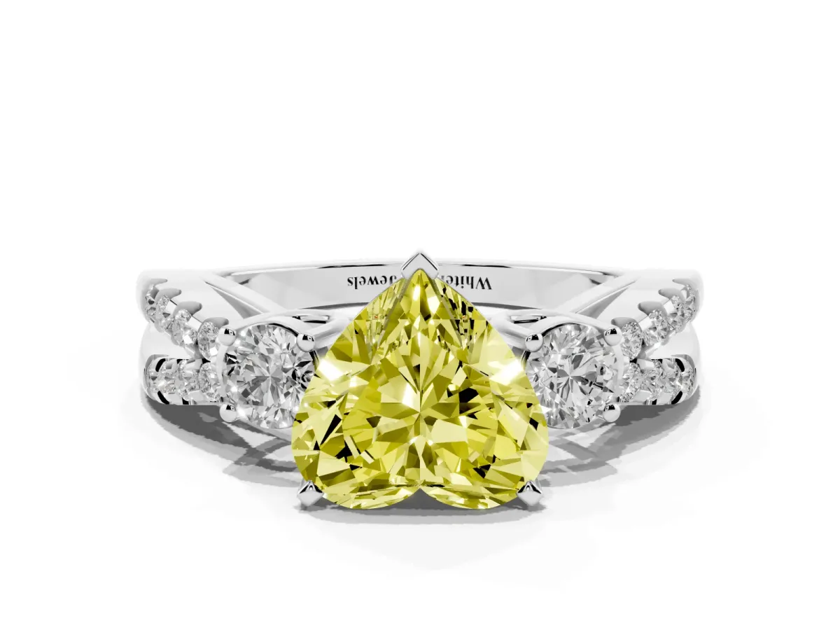 Fancy Yellow Heart Cut Diamond Three-Stone Ring with Pavé Split Shank and Four-Prong Setting Platinum