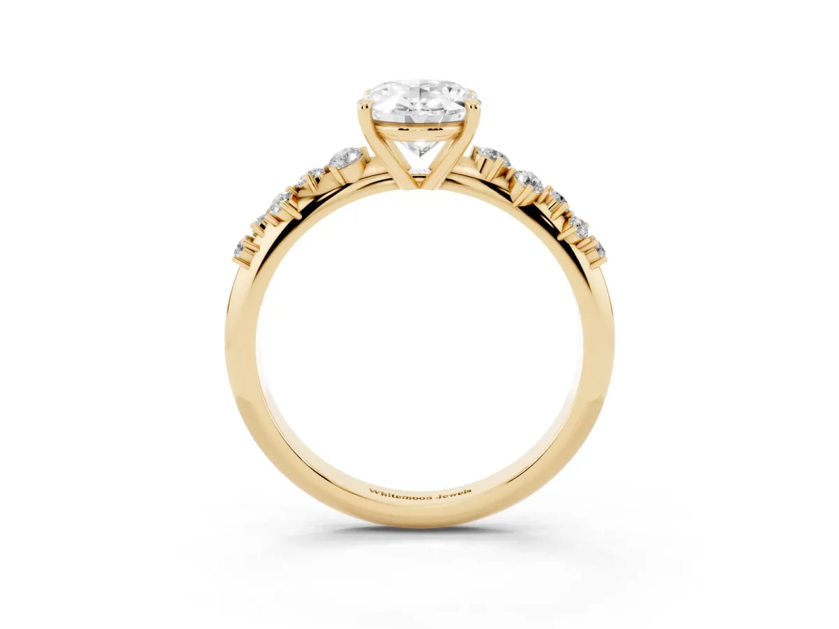 Oval Cut Diamond Cluster Side Stone Solitaire Ring with Prong Setting Yellow gold