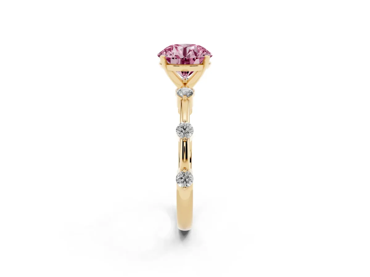 Fancy Pink Round Cut Solitaire Diamond Ring with Bezel Set Side Stones and Prong Setting Yellow gold