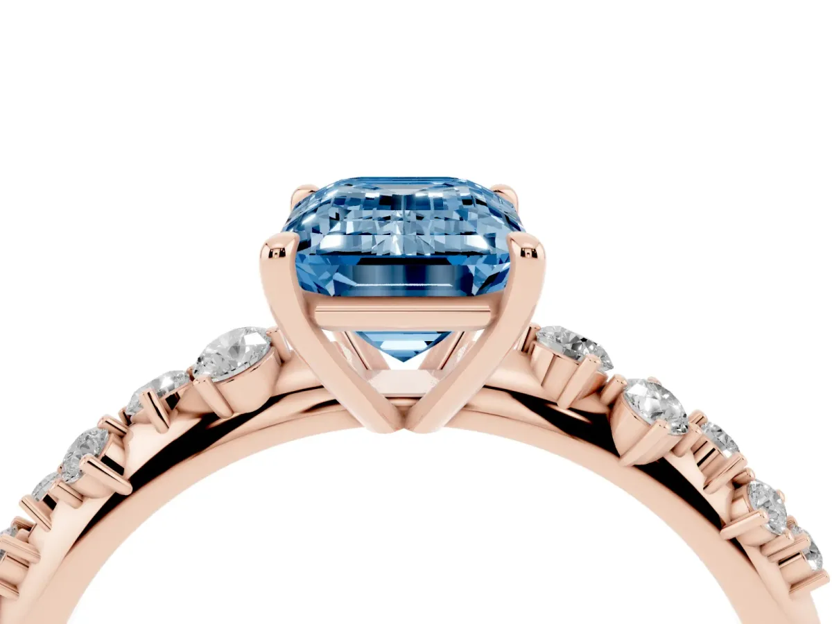 Fancy Blue Emerald Cut Diamond Cluster Side Stone Solitaire Ring with Prong Setting Rose gold