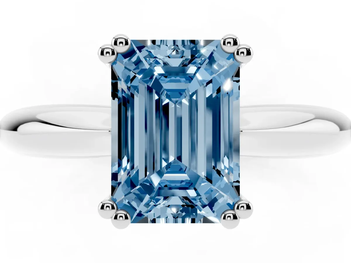 Fancy Blue Emerald Cut Cut Solitaire Engagement Ring with Tapered Band and Four-Prong Setting Silver