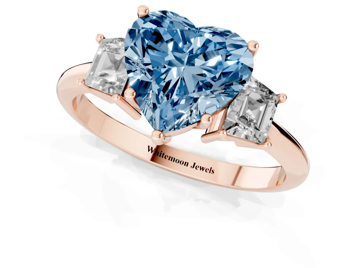 Fancy Blue Heart Cut Diamond Three-Stone Ring with Trapezoid Side Stones and Prong Setting Rose gold