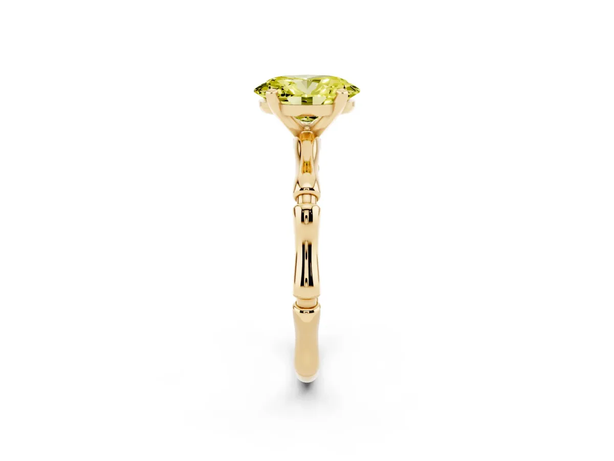 Fancy Yellow Oval Cut Solitaire Diamond Ring with Bamboo Band and Four-Prong Setting Yellow gold