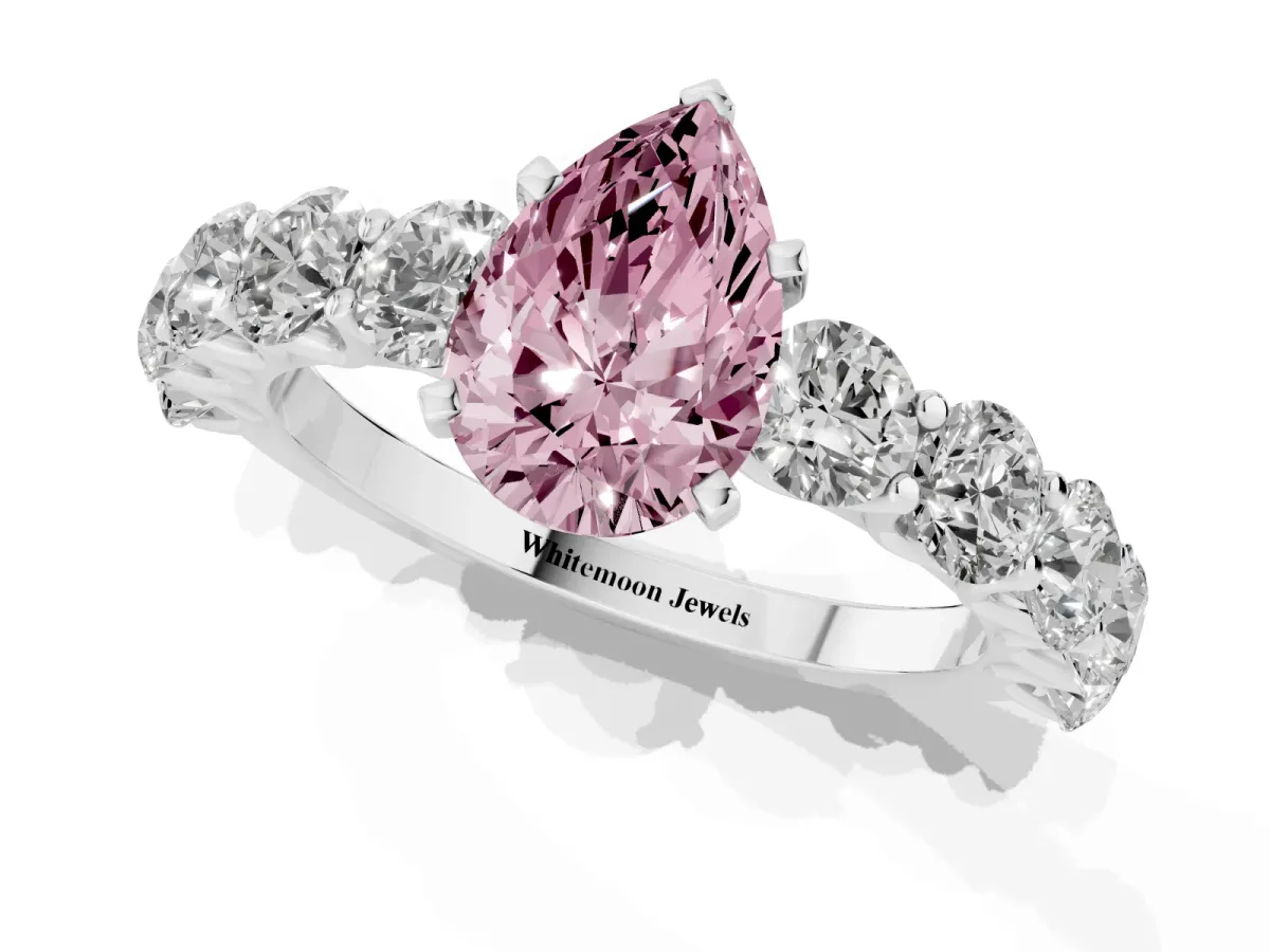 Fancy Pink Pear Cut Diamond Prong Setting with Side Stones on a Pave Band Silver