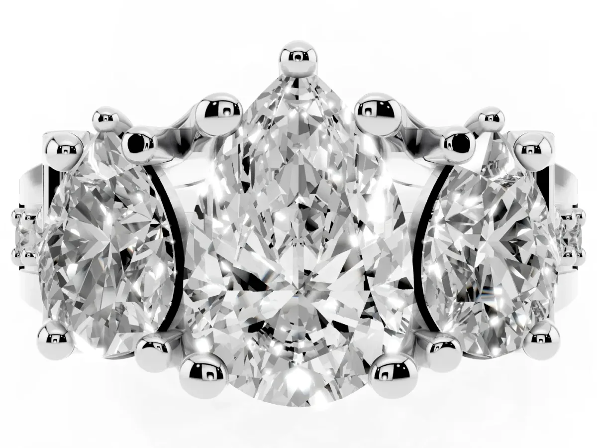 Pear Cut Diamond Three-Stone Ring with Channel Set Band and Four-Prong Setting Silver