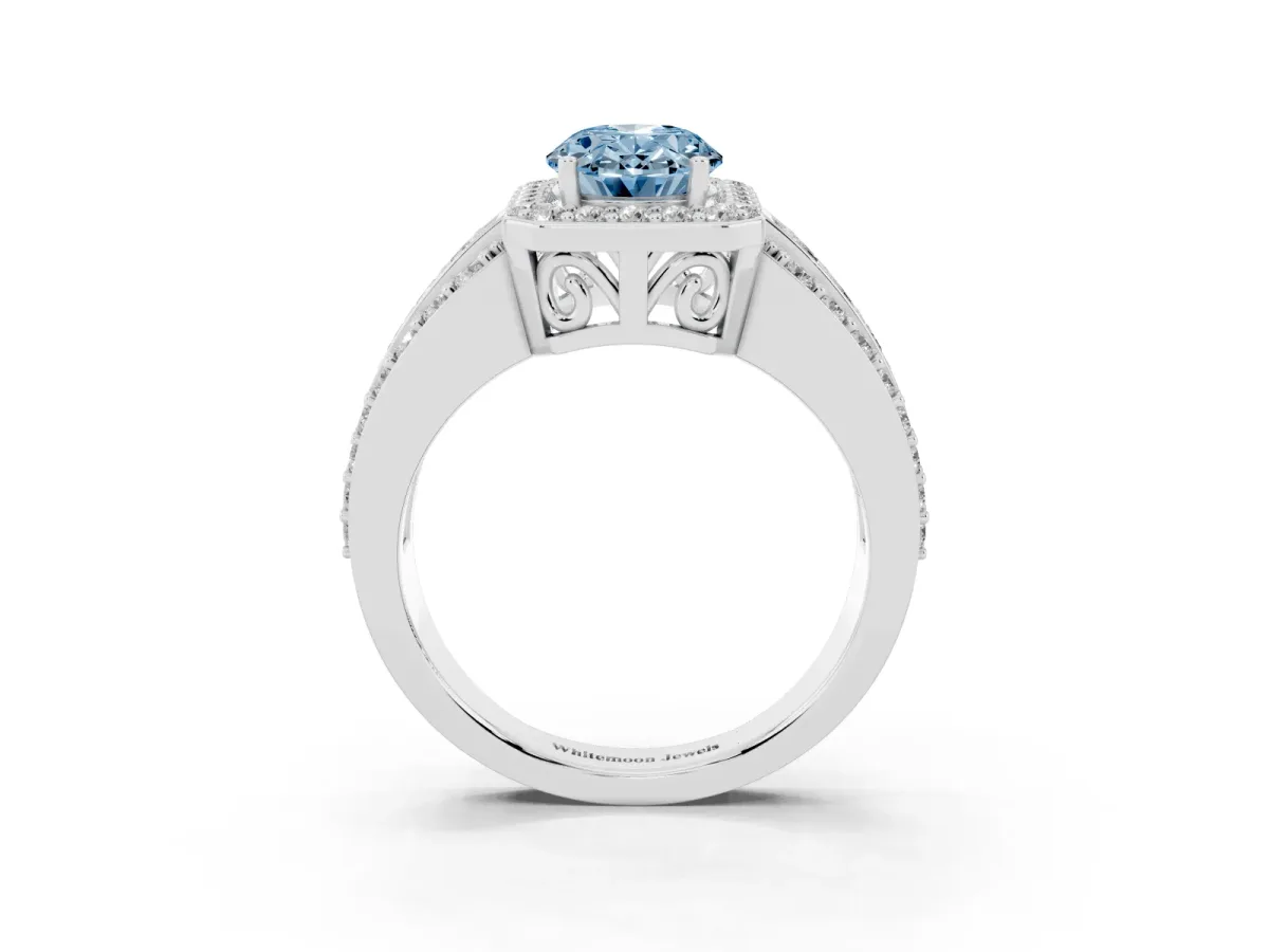 Fancy Blue Oval Cut Halo Diamond Ring with Round Split Shank and Prong Setting White gold