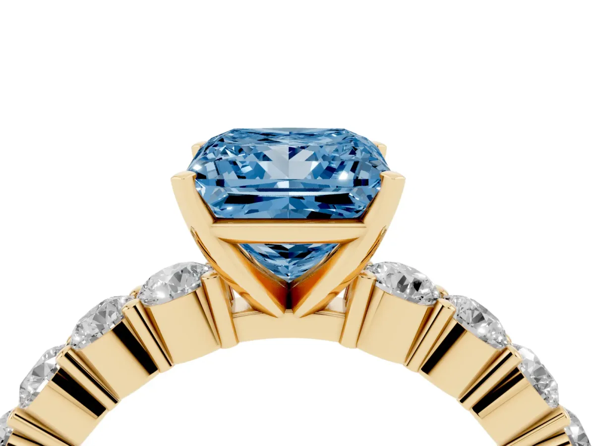 Fancy Blue Princess Cut Diamond Solitaire Ring with Shared Prong Round Side Stones Yellow gold