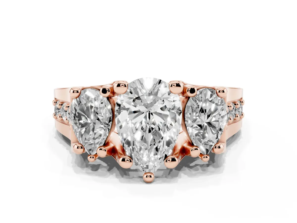 Pear Cut Diamond Three-Stone Ring with Channel Set Band and Four-Prong Setting Rose gold