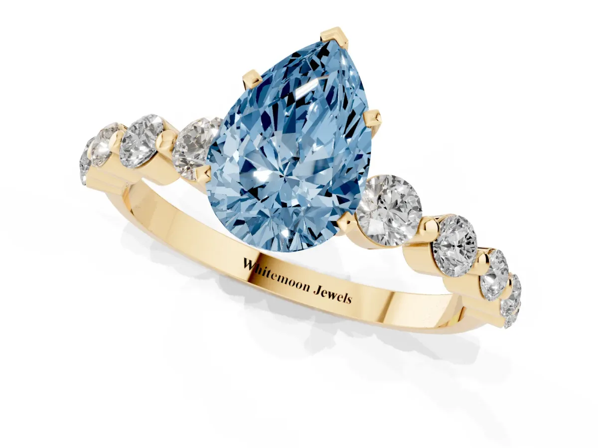 Fancy Blue Pear Cut Solitaire Diamond Ring with Pave Band and Four-Prong Setting Yellow gold