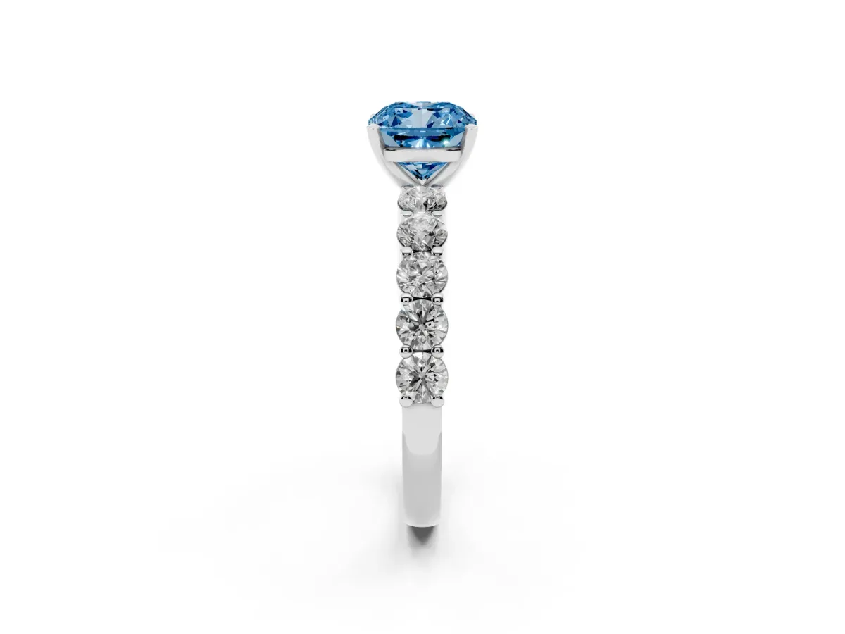 Fancy Blue Cushion Cut Diamond Solitaire Ring with Shared Prong Round Side Stones Platinum