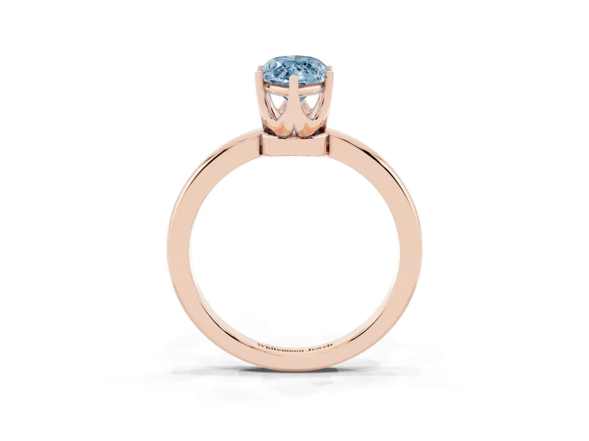 Fancy Blue Marquise Cut Solitaire Diamond Ring with Six-Prong Setting on a Classic Band Rose gold