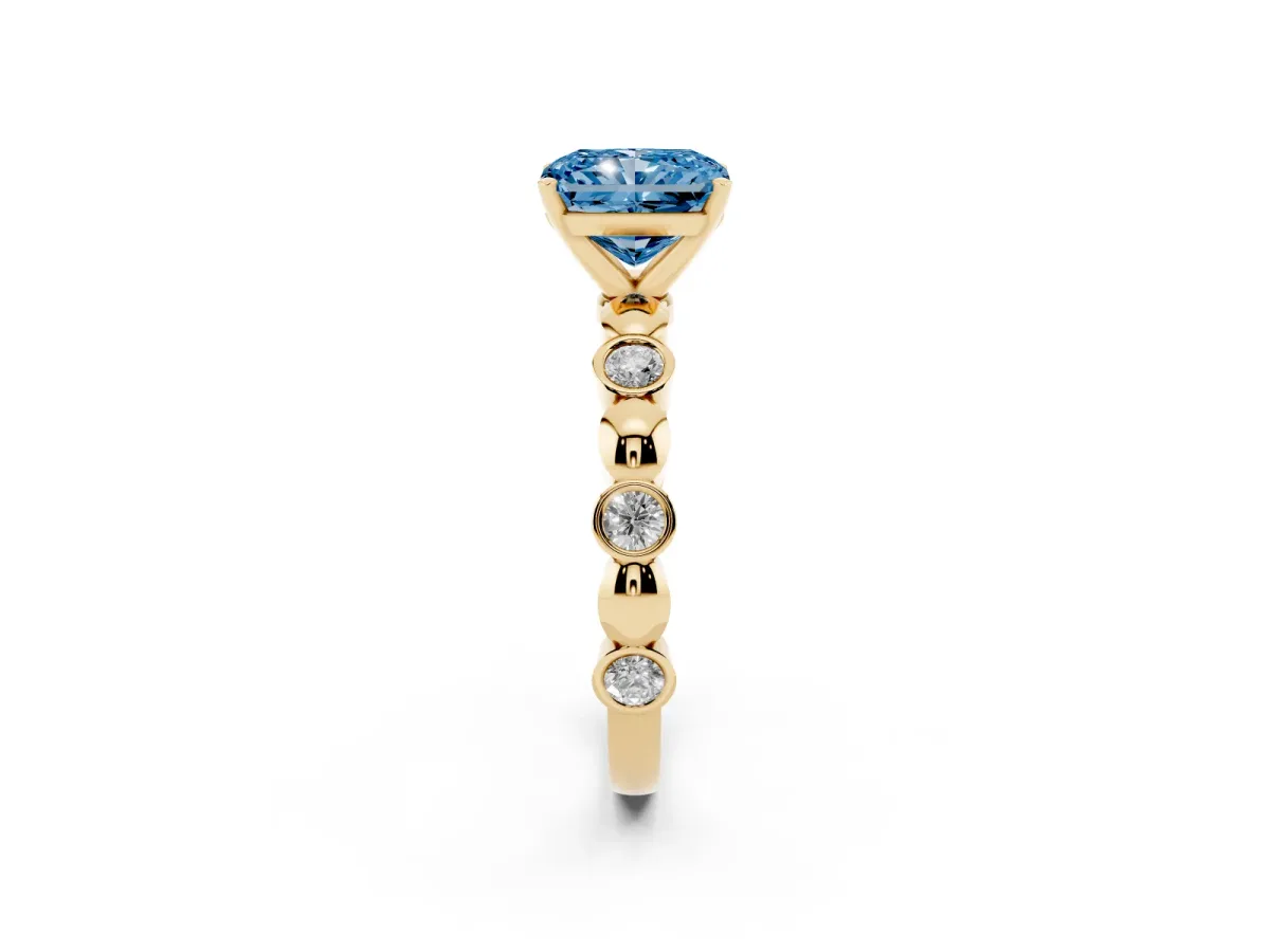 Fancy Blue Radiant Cut Solitaire Bezel-Set Diamond Ring with Beaded Band and Four-Prong Setting Yellow gold