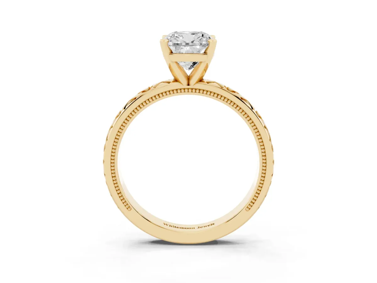 Cushion Cut Solitaire Diamond Engagement Ring with XO Engraved Band and Four-Prong Setting Yellow gold