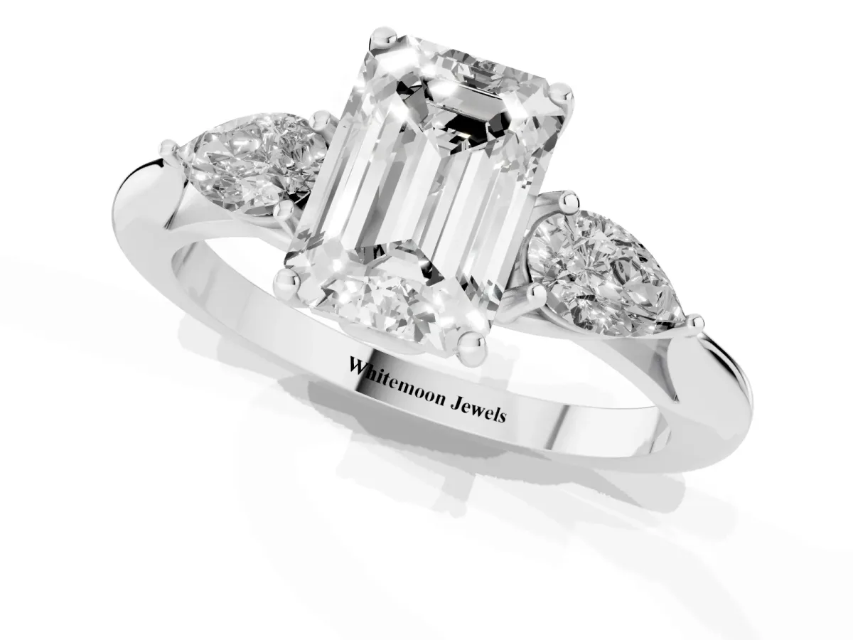 Three-Stone Emerald Cut Brilliant Diamond Solitaire Ring with Tapered Band and Four-Prong Setting Platinum