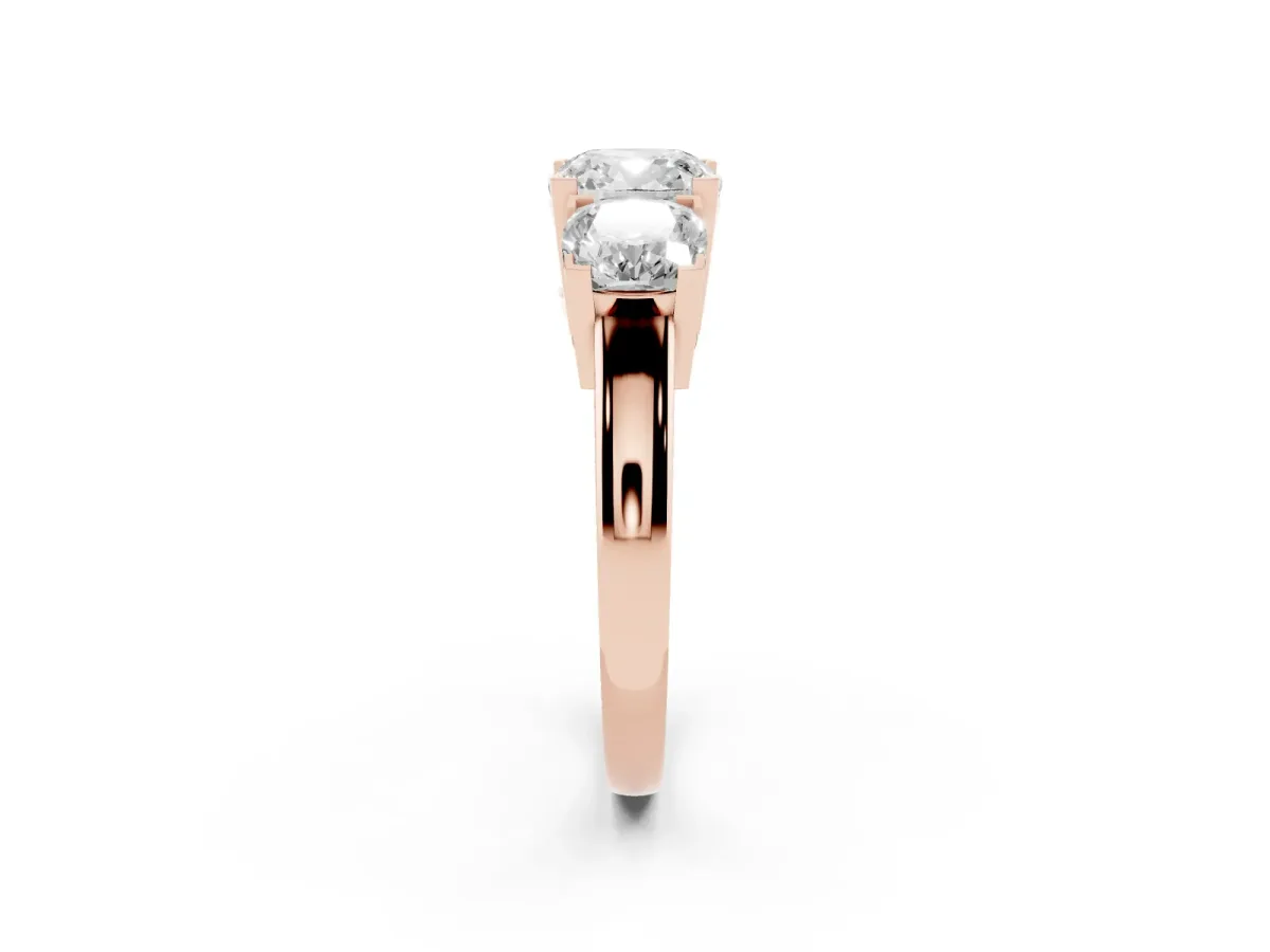 Three-Stone Cushion Cut Cut Diamond Ring with Channel Set Band and Four-Prong Setting Rose gold