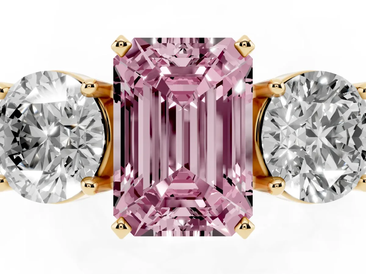 Fancy Pink Three-Stone Emerald Cut Diamond Ring with Round Side Stones, Classic Band, and Four-Prong Setting Yellow gold