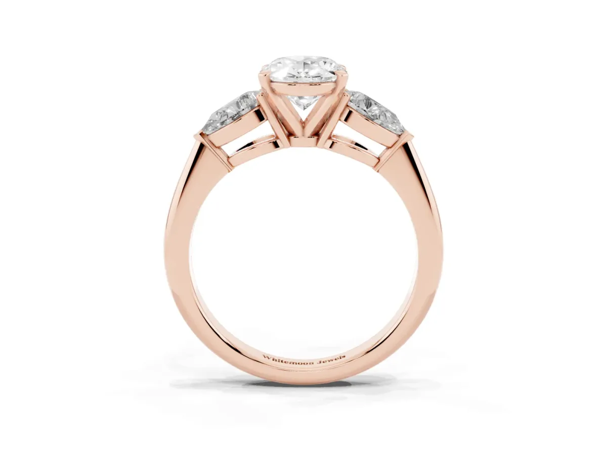 Three-Stone Oval Cut Diamond Ring with Pear Side Stones and Four-Prong Setting Rose gold